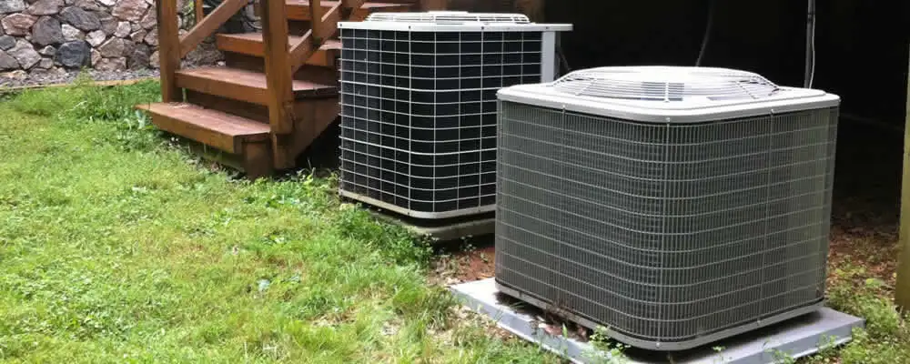 Heat pump installation and service units outside a home in Burlington, VT