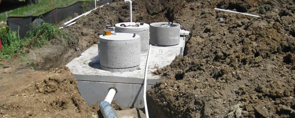 Septic system repair and installation site with tank access ports in Burlington, VT