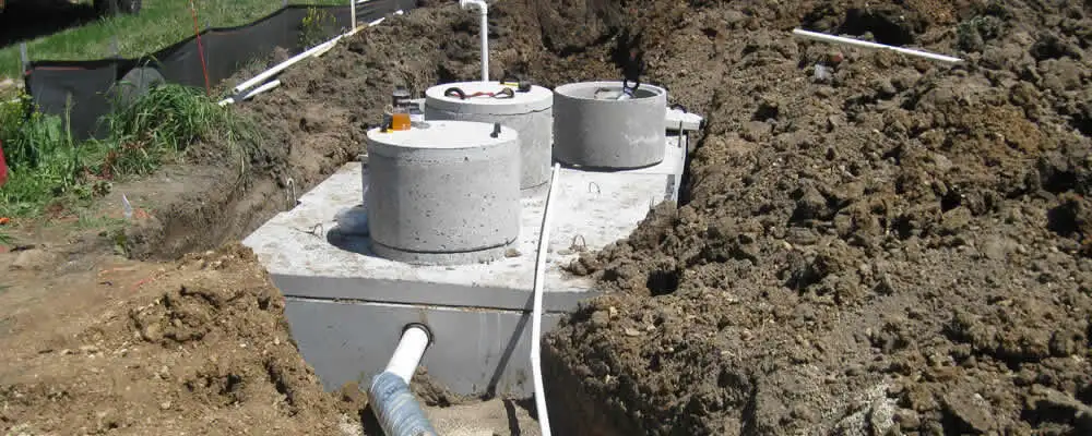 Septic system repair and installation site with tank access ports in Burlington, VT